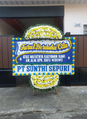 Papan Bunga Duka di Loa Buah
