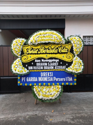 Papan Bunga Duka di Loa Buah