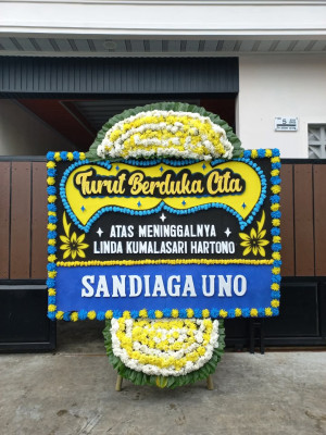Papan Bunga Duka di Loa Buah
